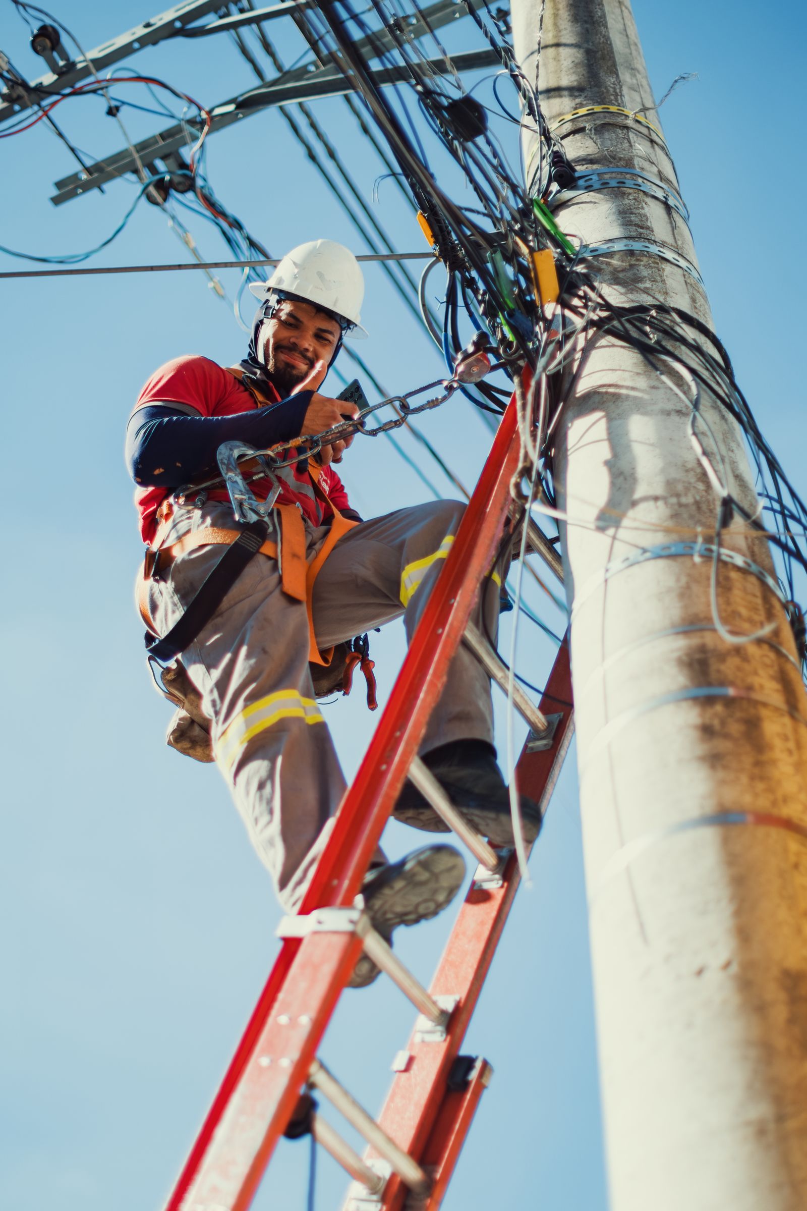 Electrician working on overhead power lines